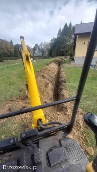 Wynajem,  usługa minikoparką oraz przyczepą z kiprem