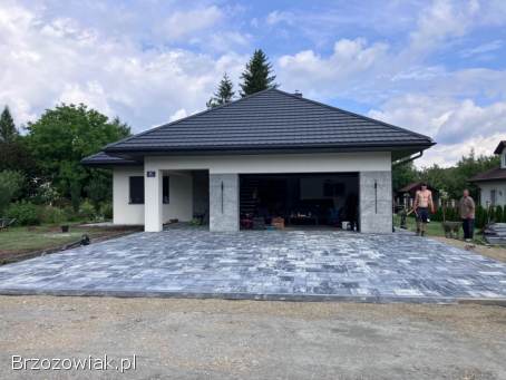 Brukarstwo Ogrodzenia Uslugi koparka wraz z wozidlem.